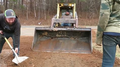 spreading gravel with skid steer|skid steer grade chart.